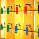 Close-up of colored lockers with keys in a sports complex.